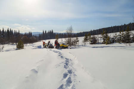 Snowmobiling in the Urals mountains on a frosty day.の写真素材