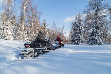 Snowmobiling in the Urals mountains on a frosty day.の写真素材