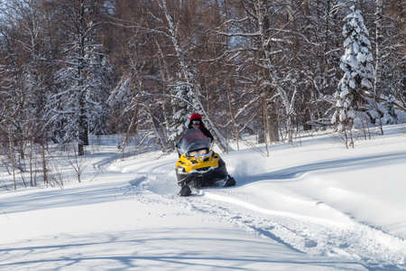 Athlete on a snowmobile.