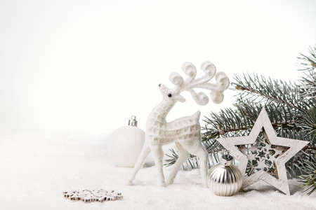 Christmas card with a deer and Christmas decorations. Copy space.の写真素材