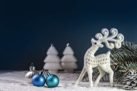 Christmas card with a deer and Christmas decorations. Copy space.の写真素材