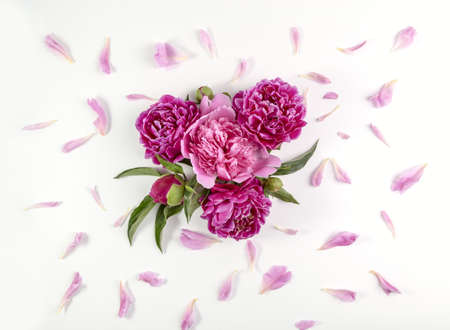 Bouquet of pink peonies on a white table. Valentine's Day gift.の写真素材