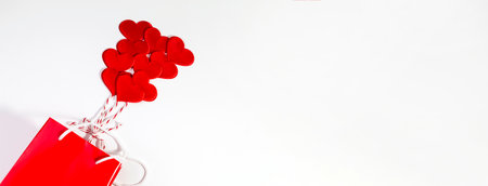 Valentine's day background with red hearts like balloons. Flat lay copy space.の写真素材