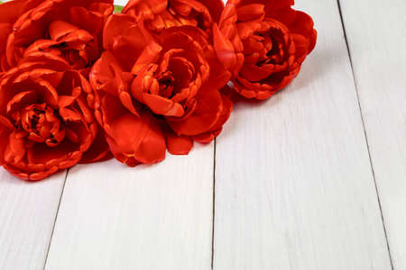 Bouquet of red tulips on a light wooden background. copyspace.の写真素材