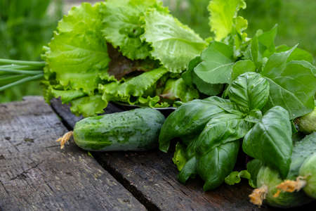 A set of vegetables for a salad diet on an old wooden table. table. copyspace.