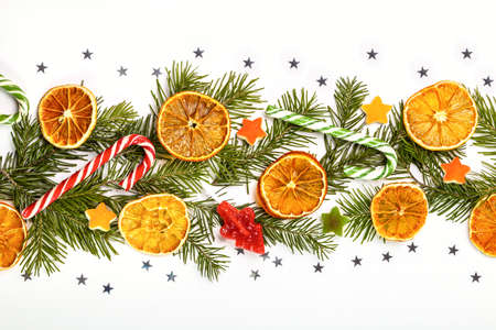 Christmas card with fir branches and Christmas decorations. Copy space.