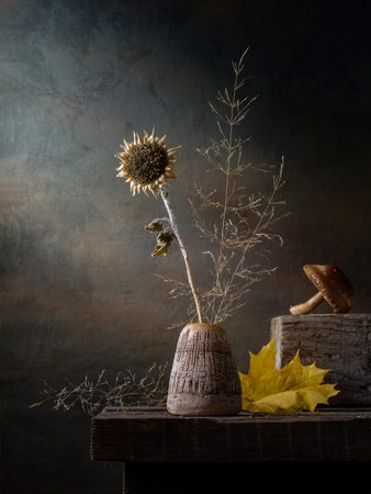 Rustic still life with dry plants on a dark background.の写真素材
