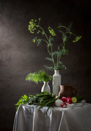 Spring still life with dill in a vase, vegetables and herbs.の写真素材