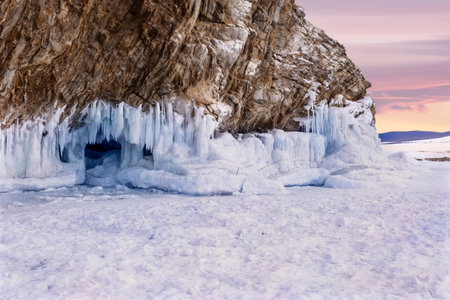 Ice grottoes and icicles on the winter lake Baikal.の写真素材