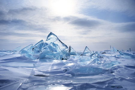 Transparent ice floe on the frozen surface of the lake. Winter Baikal.