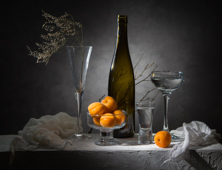 Still life with glassware and apricots.の写真素材