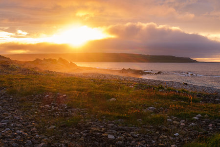 Russia, Murmansk region, Rybachy Peninsula. Sunset on the Barents Sea coast. August 2025.の写真素材