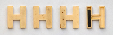 bright plastic cyrillic letters with magnet on white paperの写真素材