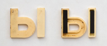 bright plastic cyrillic letters with magnet on white paperの写真素材