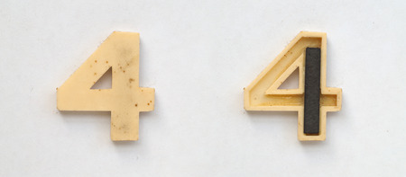 bright plastic cyrillic letters with magnet on white paperの写真素材