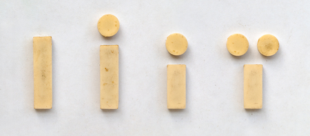 bright plastic cyrillic letters with magnet on white paperの写真素材