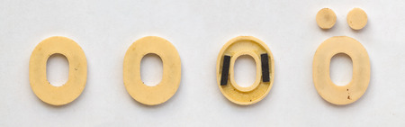 bright plastic cyrillic letters with magnet on white paperの写真素材