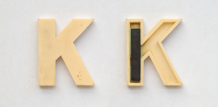 bright plastic cyrillic letters with magnet on white paperの写真素材