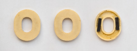 bright plastic cyrillic letters with magnet on white paperの写真素材