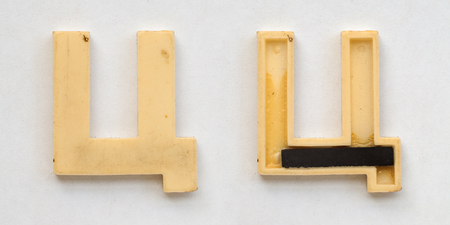 bright plastic cyrillic letters with magnet on white paperの写真素材