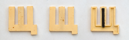 bright plastic cyrillic letters with magnet on white paperの写真素材