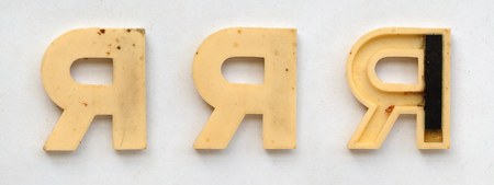 bright plastic cyrillic letters with magnet on white paperの写真素材