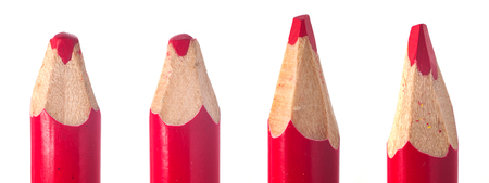 sharpened used red pencil lead in wooden wrapping macro closeupの写真素材