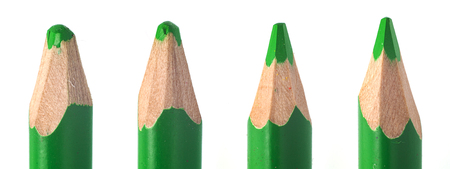 sharpened used light green pencil lead in wooden wrapping macro closeupの写真素材