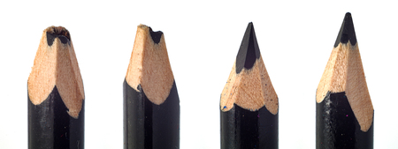 sharpened used black pencil lead in wooden wrapping macro closeupの写真素材