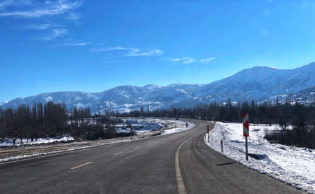 Traveling on a lonely road during winter season in Turkey.の写真素材
