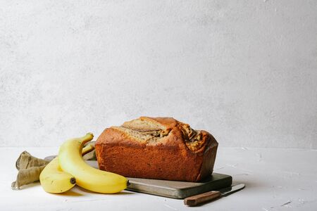Homemade banana bread on a light background copy spaceの写真素材