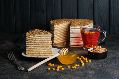 Homemade honey cake on a dark background top view copy space.の写真素材