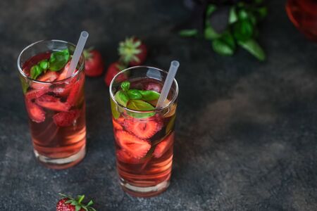 Homemade strawberry lemonade with basil on a dark background.の写真素材