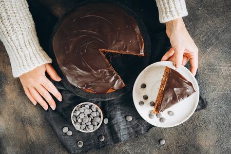 Traditional italian chocolate cake with apples and cinnamon on a dark backgroundの写真素材