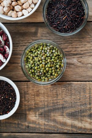 Super food. Seeds and beans assortment on a rustic background copy space. Vegetarians. Top viewの写真素材