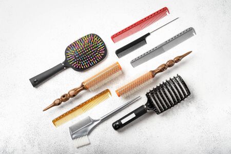Set of accessories for a beauty salon on a light background copy space top view.