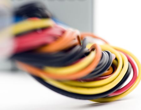 Multicolored computer cable and power supply isolated on white background