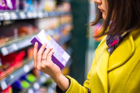 Young woman shopping in the supermarket