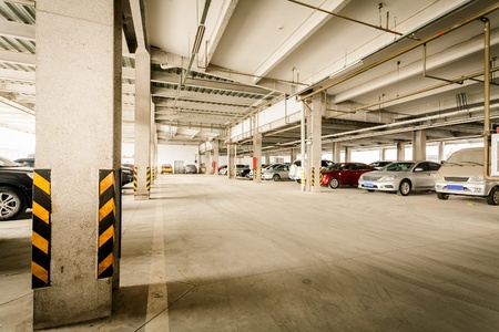 Parking garage, interior with a few parked cars.のeditorial素材