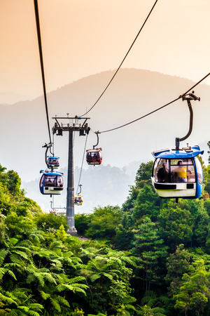 Aerial tramway moving up in tropical jungle mountainsのeditorial素材