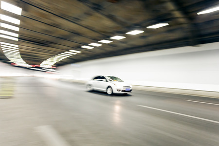 Interior of an urban tunnel with car,motion blurの写真素材