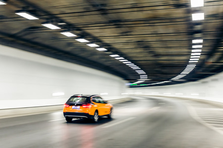 Interior of an urban tunnel with car,motion blurの写真素材