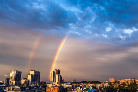 Rainbow over the cityの写真素材