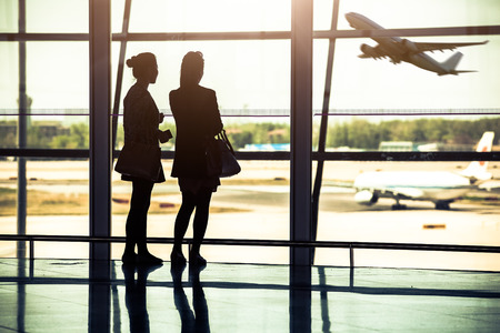 Travelers silhouettes at airport,Beijingの写真素材