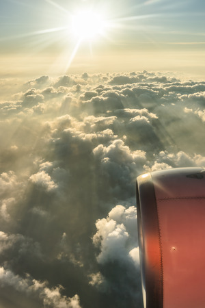 Clouds and sky as seen through window of an aircraft