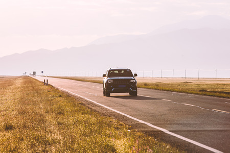 Landscape view of asphalt road on grasslandの写真素材