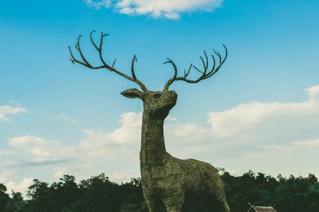 grass deer statue in the field of Thailandのeditorial素材