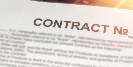 Business contract printed on a white sheet of paper and light in the corner, bannerの写真素材
