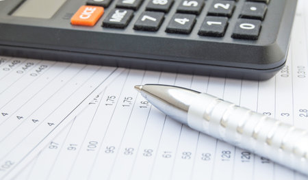 Side view calculator and pen, financial accounting and analysis, business conceptの写真素材