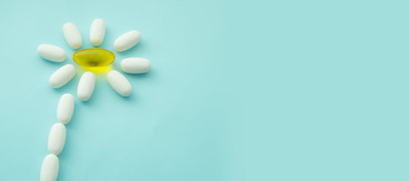 Tablets in the form of a chamomile flower. Symbol of alternative medicine, health and herbal medicine, bannerの写真素材